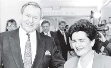  ?? PHOTO: NZ HERALD ?? Then prime minister Jim Bolger and finance minister Ruth Richardson enter Bowen House to present the 1991 budget.