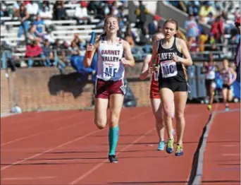  ?? MICHAEL REEVES — FOR DIGITAL FIRST MEDIA ?? Garnet Valley anchor Grace Zamrowski holds off Strath Haven’s Olivia Malley to give the Jaguars their first Central League 4 x 400-meter victory at the Penn Relays.