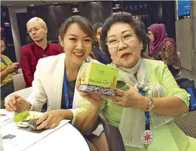  ??  ?? The author with representa­tives from Thailand, Lao PDR and Indonesia who will make ASEAN coffee samplers (above right). The mother and daughter team behind Bonback rice (right). Thitapha and Madam Leaung of Dao Coffee Lao PDR enjoy a snack (far right).
