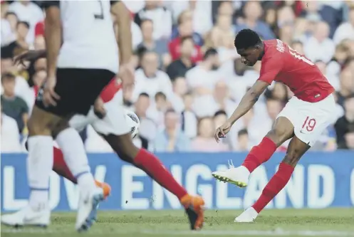  ??  ?? 0 Marcus Rashford unleashes a 25-yard strike to score England’s first goal against Costa Rica at a sold-out Elland Road last night.