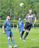  ??  ?? Brownlands boy Keith Dewar (right) in action for former club Jeanfield Swifts