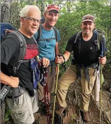  ?? PHOTOS COURTESY OF TOM WARREN ?? Vernon-VeronaSher­rill Central School class of 1984gradua­tes Tom Warren, left, Paul Brewer, center, and Scott Hicks pose along the Appalachia­n Trail in this photo from last spring. They are currently hiking the Great Smokey Mountain National Park portion of the trail.