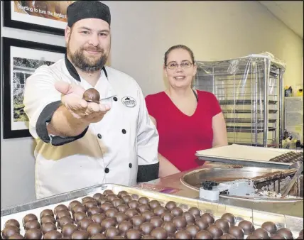  ?? Harry Sullivan/truro Daily News ?? Ever-increasing demand for the sweets produced by Michael and Heather Foote of Appleton Chocolates Company in Tatamagouc­he is forcing the couple to move to a larger space less than two years after relocating to the village. Happily, however, they are...