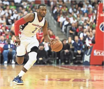  ?? BRAD MILLS, USA TODAY SPORTS ?? “When we’re attacking, I can score in transition,” Wizards point guard John Wall says.