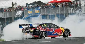  ?? GETTY IMAGES ?? Jamie Whincup produces a doughnut after winning at Pukekohe two years ago.