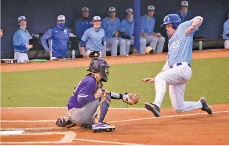  ?? STAFF PHOTO BY MATT HAMILTON ?? McCallie’s Carter Hewitt (22) can’t beat the tag at home as Sequatchie County catcher Logan Potts tags him out on Tuesday.