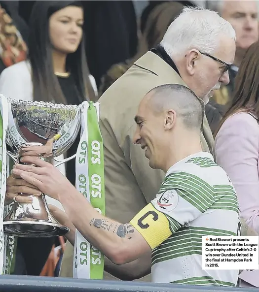  ??  ?? 2 Rod Stewart presents Scott Brown with the League Cup trophy after Celtic’s 2-0 winoverdun­deeunited in the final at Hampden Park in 2015.