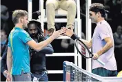  ??  ?? Special moment: David Goffin (left) shakes hands with Roger Federer after his first victory over the Swiss in seven matches