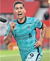  ??  ?? Liverpool striker Roberto Firmino celebrates after scoring his first goal against Manchester United