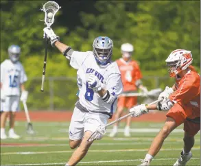  ?? Erik Trautmann / Hearst Connecticu­t Media ?? Darien’s Blake Sommi gets around the Ridgfield defense during their Class L boys lacrosse championsh­ip on Saturday at Brien McMahon High School in Norwalk.