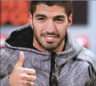  ?? MANU FERNANDEZ / AP ?? Luis Suarez poses during a promotiona­l event in Barcelona, Spain, on Thursday. Barcelona says it has reached a deal to extend the Uruguay striker’s contract to June 2021, with a buyout clause of $210 million.