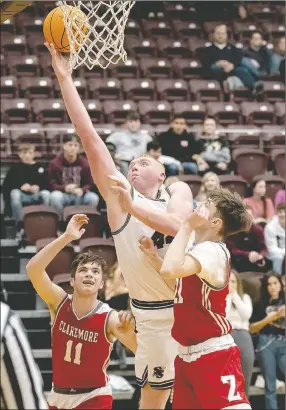  ?? Bud Sullins/Special to Siloam Sunday ?? Siloam Springs junior Jackson Ford drives to the basket against Claremore, Okla., during Friday’s opening round game of the Siloam Springs Holiday Classic.