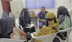  ??  ?? ADEN: An employee speaks to Ethiopian migrants at Internatio­nal Organizati­on for Migration center in the port city of Aden, Yemen. Despite Yemen’s civil war, migrants are streaming in, hoping to make their way to wealthy Saudi Arabia. Instead, they...