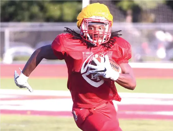  ??  ?? Homewood- Flossmoor running back Justin Hall, who excelled in the agility course at the Under Armour Camp, earned a trip to the national finals. | WORSOM ROBINSON/ FOR THE SUN- TIMES