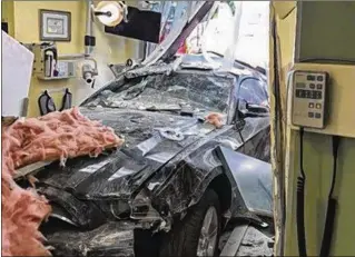  ?? ANGIE LOPEZ-BELIO / CONTRIBUTE­D ?? A car driven by a 16-year-old boy crashed into the dental office of Dr. Marisol Lopez-Belio last week, causing extensive damage.