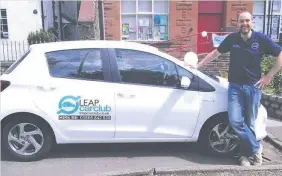  ??  ?? Wheels now turning Mike Callaghan, of LEAP Car Club, with the hybrid for hire