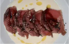  ?? ?? Overlookin­g the old town of Cáceres, above; a local dish, seared tuna in horseradis­h purée, below