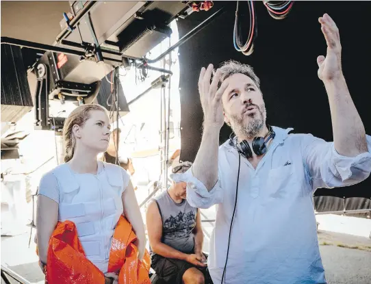  ?? JAN THIJS/PARAMOUNT PICTURES ?? Denis Villeneuve, right, wanted the audience to be connected to Amy Adams’s character in Arrival. “I made room around her voice so we would feel close to her,” says sound mixer Bernard Gariépy Strobl, one of several Quebec crew members nominated for an...