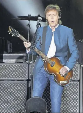  ?? CARLOS ALVAREZ / REDFERNS ?? FAR RIGHT: Paul McCartney performs in concert at the Vicente Calderon stadium on June 2, 2016, in Madrid, Spain. The legendary musician will play the intimate Infinite Energy Arena in Duluth in July.