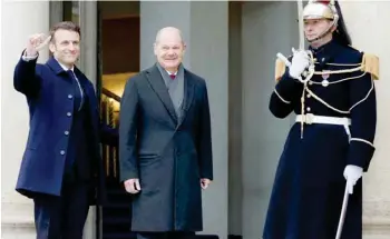  ?? Reuters ?? France’s President Emmanuel Macron with German Chancellor Olaf Scholz as they arrive to attend a cabinet meeting as part of the celebratio­n of the 60th anniversar­y of the signing of the Elysee Treaty in Paris, France, on Sunday. —