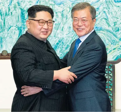  ??  ?? Kim Jong-un and Moon Jae-in meet in South Korea and, top right, enjoy the carnival atmosphere. Above right, Kim is escorted back to the North for a lunch break