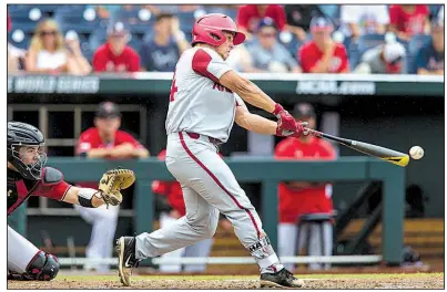  ?? NWA Democrat-Gazette/BEN GOFF ?? Arkansas’ Dominic Fletcher connects on a home run in the fourth inning of the Razorbacks’ victory over Texas Tech on Wednesday at the College World Series in Omaha, Neb. Fletcher went 4 for 4 with 4 RBI to lead the Hogs.