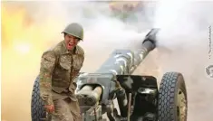  ??  ?? Στρατιώτης στο Ναγκόρνο-Καραμπάχ βάλλει κατά των δυνάμεων του Αζερμπαϊτζ­άν.