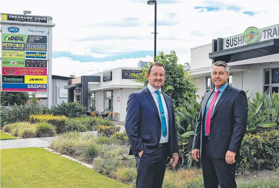  ??  ?? Kyle Youngson and Steve Clark, of CBRE, pictured outside of the Treasure Cove Super Centre in Biggera Waters.