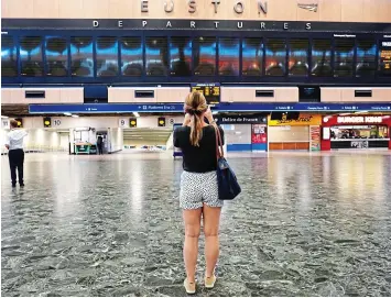  ?? ?? Euston, we have no services: Blank departure boards in the station’s main hall