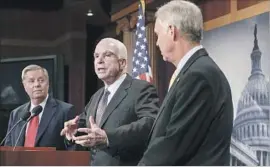  ?? J. Scott Applewhite Associated Press ?? REPUBLICAN Sens. Lindsey Graham, John McCain and Ron Johnson, from left, hold a news conference at the Capitol as the GOP struggles to reach agreement.