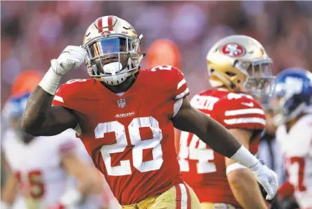  ?? Marcio Jose Sanchez / Associated Press ?? Running back Carlos Hyde celebrates during the second half of the 49ers’ victory — their first of the season — at Levi’s Stadium.