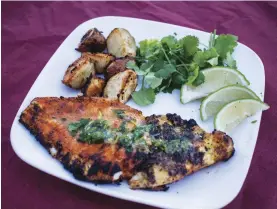  ?? Wheeler Cowperthwa­ite/Special to the Valley Press ?? While this might be called blackened catfish, when cooked on the grill, it retains the red coloring from a chile-based rub.