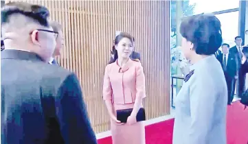  ??  ?? Kim Jong Un’s wife Ri Sol Ju arrives to join the inter-Korea dinner at the truce village of Panmunjom, in this still frame taken from video. — Reuters photo