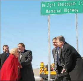  ?? SUBMITTED PHOTO - EAST PENN ?? Helen Breidegam, next to son Dan, admires the new sign in honor of her late husband DeLight Breidegam Jr. State Representa­tives Ryan Mackenzie, Mark Gillen, and David Maloney help commemorat­e this meaningful highway designatio­n.