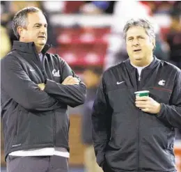  ?? YOUNG KWAK AP ?? TCU coach Sonny Dykes (left) coached under Mike Leach at two schools, and utilized Leach’s “Air Raid” offense to lead the Horned Frogs to a CFP title game.