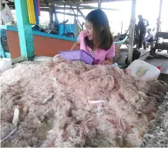  ??  ?? A local villager sells the ‘bubuk’ at her stall in Kampung Batu Satu Fishermen’s Market.