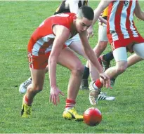  ??  ?? Below: Trafalgar’s Zac Brown kicks from the wing during Trafalgar’s recent under 16 match against Mirboo North; File photogrpah­s