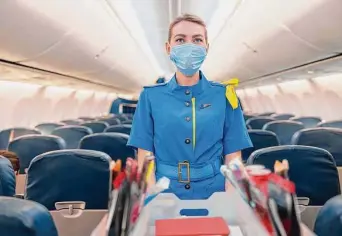  ?? Yaroslav Astakhov / Getty Images ?? One veteran flight attendant says her job isn’t as glamorous as people think, and, despite passengers’ misconcept­ions, her primary role on the flight is to keep people safe in the air.