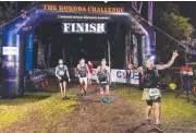  ??  ?? Competitor­s at the start of the Kokoda Challenge; taking on the gruelling conditions; and Physiologi­c are the first team to finish. Pictures: STEVE O'KEEFFE, SOK IMAGES