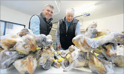  ?? Picture: FREDLIN ADRIAAN ?? PET-FRIENDLY: Canine Boutique and Pet Deli owner John Vye, right, with new owner Gavin Faulds, of Petman Holdings