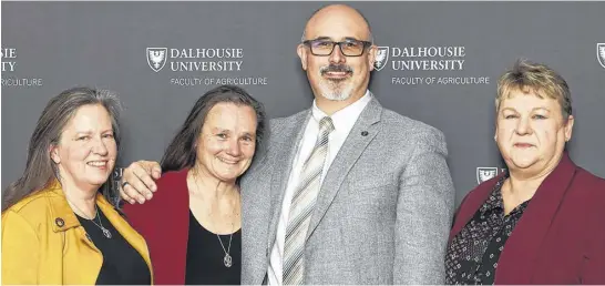  ?? CONTRIBUTE­D ?? Joy Galloway-Jones recently received an honorary Barley Ring during Dalhousie Agricultur­al campus’ Barley Party. From left, Keltie Jones, Joy’s wife; Galloway-Jones; Dal AC dean David Gray; and Janine Gray, David’s wife and a senior instructor in the Department of Animal Science and Aquacultur­e.