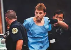  ?? AP ?? Waffle House shooting suspect Travis Reinking is escorted into a detention centre for booking on Monday in Nashville.