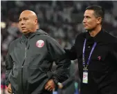  ?? Getty Images ?? Qatar head coach ‘Tintin’ Marquez Lopez, left, and Jordan manager Hussein Ammouta during the Asian Cup final