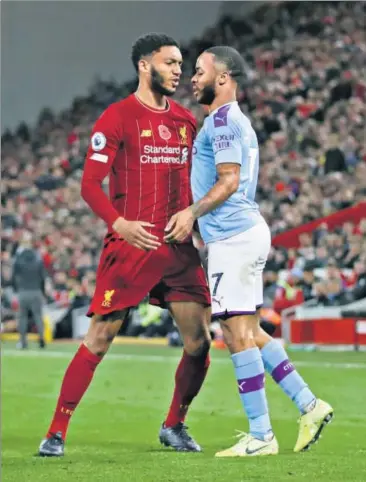  ??  ?? Liverpool’s Joe Gomez (left) and Manchester City's Raheem Sterling clashed during their Premier League match on Sunday and there was a repeat when they met the next day in the England camp. REUTERS