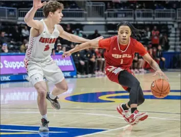  ?? JJ LaBella/For the Post-Gazette ?? Penn Hills’ Noah Barren, right, tries to drive past Peters Township’s Brendan McCullough Thursday at Petersen Events Center. Barren scored a game-high 22 points to lead the Indians to the Class 5A championsh­ip.