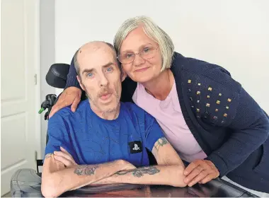  ??  ?? Devoted carer Martin with his partner of 27-years Sadie, who is desperate to raise awareness of the disease