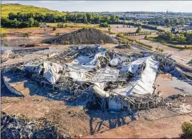  ?? DAVID GURALNICK / DETROIT NEWS ?? The Palace of Auburn Hills lies in rubble after undergoing a controlled demolition in Auburn Hills, Michigan, on Saturday. Opened in 1988, the multi-use arena housed the Detroit Pistons until they relocated downtown in 2017.