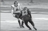  ?? HERALD PHOTO BY JUSTIN SEWARD ?? Lethbridge Steel’s Kate McAdam tries to run the ball up the field and prepared for a tackle from Calgary Rage’s Jeri Flamont during the season opener at University of Lethbridge Community Stadium on Saturday night.