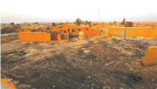  ??  ?? KALAK: A picture shows houses in an Iraqi Kurdish Kakai minority village located near the town of Kalak, east of Mosul, after Iraqi forces recaptured it from Islamic State (IS) group jihadists a few months ago. — AFPMine clearing