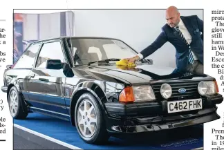  ?? ?? GLEAMING: A final polish for the Princess of Wales’s car ahead of the auction